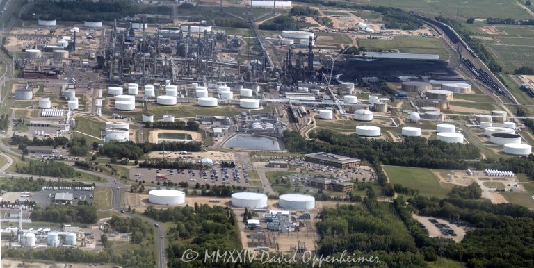 Flint Hills Resources Pine Bend Refinery at 12555 Clark Rd in Rosemount, Minnesota aerial view - © 2024 David Oppenheimer - Performance Impressions aerial photography archives - https://performanceimpressions.com Pine Bend, Pine Bend Refinery, Pine Bend Refinery aerial, Pine Bend aerial, refinery, 12555 Clark Rd, Koch Industries, Rosemount, Minnesota, Flint Hills Resources, Flint Hills Resources Pine Bend, Flint Hills, oil, petroleum, fuel, Dakota County, production, transportation fuel, liquid, energy, Midwest, gasoline, diesel, 55068, diesel fuel, heating fuel, heating oil, jet fuel, propane, asphalt, synthetics, barrels, fossil fuels, tanks, solar, solar power, emissions, CO2, carbon dioxide, greenhouse gasses, environment, carbon, carbon fuels, storage tanks, tank field, aerial, aerial view, aerial photography, aerial photographer, David Oppenheimer, color, horizontal, United States, 1-13985601741,