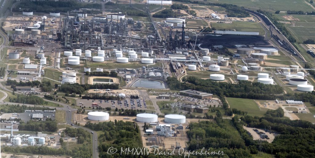Flint Hills Resources Pine Bend Refinery at 12555 Clark Rd in Rosemount, Minnesota aerial view - © 2024 David Oppenheimer - Performance Impressions aerial photography archives - https://performanceimpressions.com Pine Bend, Pine Bend Refinery, Pine Bend Refinery aerial, Pine Bend aerial, refinery, 12555 Clark Rd, Koch Industries, Rosemount, Minnesota, Flint Hills Resources, Flint Hills Resources Pine Bend, Flint Hills, oil, petroleum, fuel, Dakota County, production, transportation fuel, liquid, energy, Midwest, gasoline, diesel, 55068, diesel fuel, heating fuel, heating oil, jet fuel, propane, asphalt, synthetics, barrels, fossil fuels, tanks, solar, solar power, emissions, CO2, carbon dioxide, greenhouse gasses, environment, carbon, carbon fuels, storage tanks, tank field, aerial, aerial view, aerial photography, aerial photographer, David Oppenheimer, color, horizontal, United States, 1-13985601741,