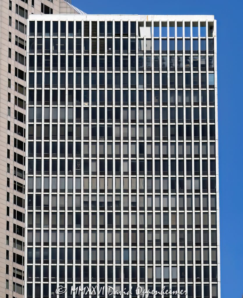 Plaza on DeWitt at 260 East Chestnut Street rises in Chicago’s Streeterville neighborhood with a precise grid of travertine-clad concrete columns and tinted windows. Originally the DeWitt-Chestnut Apartments, the Skidmore, Owings & Merrill tower pioneered Fazlur Rahman Khan’s framed-tube structural system before its conversion to condominiums, making the residential high-rise an important work of postwar Chicago engineering – © 2026 David Oppenheimer – Performance Impressions photography archives https://performanceimpressions.com Plaza on DeWitt, Plaza on DeWitt Chicago, Plaza on DeWitt Condominiums, The Plaza on DeWitt, Plaza on Dewitt, 260 East Chestnut Street, 260 E Chestnut Street, 260 E Chestnut St, DeWitt-Chestnut Apartments, DeWitt Chestnut Apartments, DeWitt Chestnut Apartment Building, DeWitt Plaza, North DeWitt Place, DeWitt Place, East Chestnut Street, Chestnut Street, Streeterville, Streeterville Chicago, Near North Side, downtown Chicago, Magnificent Mile, Mag Mile, Lake Michigan, Oak Street Beach, Lake Shore Park, Chicago, Chicago Illinois, Chicago IL, Illinois, 60611, facade, building exterior, exterior, tower exterior, upper tower, travertine facade, travertine marble, travertine cladding, marble facade, stone facade, concrete facade, window grid, concrete grid, tinted windows, tinted glass, anodized aluminum, aluminum windows, closely spaced columns, perimeter columns, reinforced concrete, concrete structure, framed tube, framed-tube system, tube structure, tubular structure, structural system, structural engineering, wind resistance, spandrels, modern architecture, modernist architecture, midcentury modern, postwar architecture, Chicago modernism, residential architecture, high-rise architecture, Chicago architecture, architecture, architectural photography, condominium tower, condo tower, residential tower, residential high rise, condominium building, residential building, condominiums, condos, Chicago condos, Streeterville condos, high rise, skyscraper, tower, building, housing, multifamily, former apartments, condo conversion, real estate, Chicago real estate, Streeterville real estate, condominium real estate, condo real estate, residential real estate, lakefront real estate, Skidmore Owings & Merrill, Skidmore Owings Merrill, SOM, Bruce Graham, Fazlur Rahman Khan, Fazlur Khan, Illinois architecture, United States, licensing, image licensing, commercial imagery, photography licensing, art, print, fine art, commercial photography, David Oppenheimer, vertical, 1-15213827141