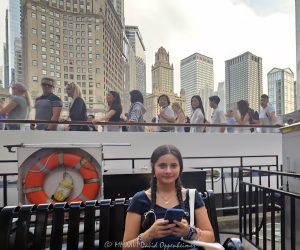 Chicago Architecture Cruise on the Chicago River Chicago architecture cruise on the Chicago River in downtown Chicago, Illinois, with a young visitor seated in the foreground and tourists aboard a riverboat against the Wacker Drive skyline. LondonHouse Chicago, The Royal Sonesta Chicago Downtown, the Jewelers Building, One East Wacker, the Leo Burnett Building and 77 West Wacker rise behind the boat, creating a quintessential Chicago tourism and riverfront architecture scene – © 2026 David Oppenheimer – Performance Impressions photography archives https://performanceimpressions.com Chicago architecture cruise, architecture cruise, Chicago river cruise, Chicago River, Chicago architecture, Chicago architecture tour, architecture tour, Chicago architecture boat tour, architecture boat tour, Chicago River boat tour, Chicago River architecture cruise, Chicago boat tour, boat tour, river cruise, river tour, riverboat, tour boat, passenger boat, boat, cruise, sightseeing cruise, sightseeing boat, sightseeing, Chicago sightseeing, Chicago tours, Chicago tour, Visit Chicago, visit Chicago, Chicago tourism, Chicago tourist, Chicago tourists, tourist, tourists, tourism, Chicago visitor, Chicago visitors, visitor, Chicago travel, Chicago trip, Chicago vacation, Chicago vacations, Chicago attractions, Chicago attraction, things to do Chicago, Chicago destination, downtown Chicago, Chicago Loop, Loop, Chicago, Illinois, Chicago River tourism, river tourism, riverfront, Chicago riverfront, waterfront, river view, architecture, buildings, Chicago buildings, skyscrapers, Chicago skyscrapers, skyscraper, towers, tower, high-rise, skyline, Chicago skyline, downtown skyline, cityscape, urban architecture, river architecture, riverfront architecture, Wacker Drive, Wacker architecture, girl, teenager, teen, young visitor, smartphone, cell phone, bench, family travel, travel, vacation, summer tourism, LondonHouse Chicago, LondonHouse, London House, LondonHouse hotel, LondonHouse Chicago Curio Collection by Hilton, Curio Collection, Hilton, Hilton hotel, Chicago hotel, riverfront hotel, HLT, NYSE HLT, London Guarantee Building, London Guarantee, 85 East Wacker, 85 E Wacker, Beaux Arts, Beaux Arts architecture, Alfred Alschuler, Goettsch Partners, The Royal Sonesta Chicago Downtown, Royal Sonesta, Sonesta Chicago, Sonesta, Sonesta hotel, 71 East Wacker, 71 E Wacker, downtown hotel, Jewelers Building, Jewelers Building Chicago, Jewelers, 35 East Wacker, 35 E Wacker, Pure Oil Building, North American Life Building, Chicago Landmark, Giaver & Dinkelberg, Giaver Dinkelberg, Joachim Giaver, Frederick Dinkelberg, terra cotta, historic architecture, historic building, One East Wacker, 1 East Wacker, One E Wacker, Kemper Building, Kemper, Shaw Metz Associates, Shaw Metz, office tower, marble facade, Leo Burnett Building, Leo Burnett, 35 West Wacker, 35 W Wacker, Roche Dinkeloo, Kevin Roche, John Dinkeloo, postmodern, postmodern architecture, 77 West Wacker, 77 W Wacker, RR Donnelley Building, R.R. Donnelley Building, RR Donnelley, United Building, Ricardo Bofill, Bofill, office building, commercial architecture, Chicago hotels, United States, USA, Chicago photography, architecture photography, river photography, travel photography, tourism photography, street photography, lifestyle photography, editorial photography, cityscape photography, architectural photography, fine art photography, Chicago art, architecture art, Chicago print, river art, photographic print, fine art print, archival print, gallery print, collector print, wall art, licensing, image licensing, commercial imagery, photography licensing, art, print, fine art, commercial photography, David Oppenheimer, Performance Impressions, Performance Impressions photography archives, horizontal, 1-15213827141