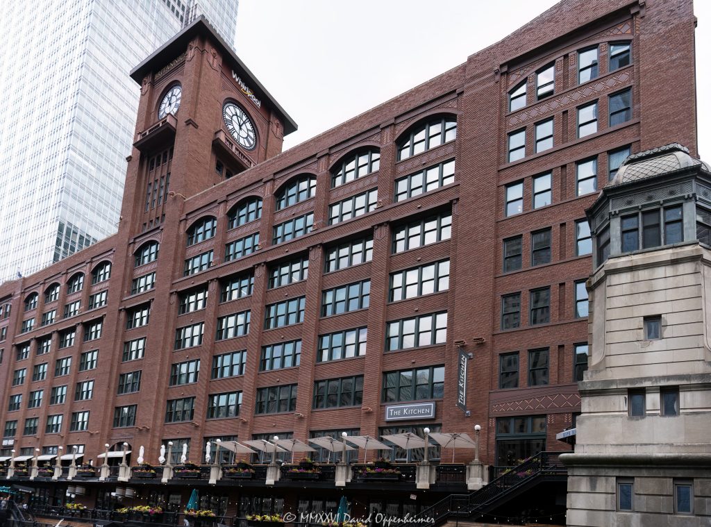 Reid Murdoch Building at 325 North LaSalle Street in River North shows the historic red brick facade, terra cotta detailing, and clock tower of the former Reid, Murdoch & Co. grocery warehouse. Designed by George C. Nimmons, the Chicago Landmark building is also known as the Reid, Murdoch & Co. Building and Reid Murdoch Center, with The Kitchen restaurant visible at street level and World of Whirlpool occupying space in the historic clock tower – © 2026 David Oppenheimer – Performance Impressions photography archives https://performanceimpressions.com Reid Murdoch Building, Reid Murdoch & Co Building, Reid Murdoch and Co Building, Reid, Murdoch & Co Building, Reid Murdoch Center, Reid Murdoch Chicago, Reid Murdoch Building Chicago, 325 N LaSalle Street, 325 North LaSalle Street, 325 N La Salle Dr, 325 N LaSalle, The Kitchen, The Kitchen Chicago, The Kitchen restaurant, World of Whirlpool, Whirlpool Corporation, Whirlpool showroom, Whirlpool Chicago, Whirlpool experience center, Britannica, Encyclopaedia Britannica, Britannica Building, River North, River North Chicago, downtown Chicago, Chicago Illinois, Chicago IL, North LaSalle Street, LaSalle Street, North Clark Street, Clark Street, Kinzie Street, 60654, facade, building exterior, exterior, clock tower, clocktower, brick facade, red brick, brick building, terra cotta, terra cotta trim, historic facade, decorative masonry, masonry, historic building, landmark building, Chicago Landmark, National Register, commercial building, office building, office warehouse, warehouse building, former warehouse, grocery warehouse, wholesale grocer, wholesale grocery, Chicago School, industrial architecture, historic architecture, commercial architecture, Chicago architecture, architectural photography, George C Nimmons, George C. Nimmons, Reid Murdoch & Company, Reid Murdoch and Company, City of Chicago Central Office Building, Central Office Building, Friedman Properties, office tenant, restaurant, retail, historic Chicago, Chicago history, River North landmark, Illinois architecture, United States, licensing, image licensing, commercial imagery, photography licensing, art, print, fine art, commercial photography, David Oppenheimer, horizontal, 1-15156784411