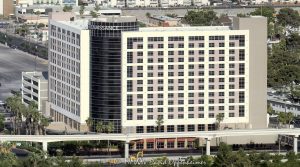 Renaissance Las Vegas Hotel on the Las Vegas Strip at 3400 Paradise Rd in Las Vegas, Nevada aerial view - © 2025 David Oppenheimer - Performance Impressions travel photography archives - https://performanceimpressions.com Renaissance Las Vegas Hotel, Renaissance Las Vegas, Renaissance Hotels, Renaissance Las Vegas Hotel Aerial, Renaissance Las Vegas aerial, Las Vegas Strip, 3400 Paradise Rd, Marriott, non-smoking, non-gaming, Perini Building, Perini Building Company, Wheelock, Rockpoint Group, Rockpoint Group & Highgate, Marriott Hotels, Marriott International, hotel tower, high-rise, tower, Las Vegas, Vegas, Nevada, 89169, exterior, architecture, modern architecture, contemporary architecture, facade, glazing, cladding, crown, design, resort, boutique, boutique hotel, real estate, luxury hotel, commercial real estate, hospitality, resort photography, resort photographer, Desert Inn & Paradise, Desert Inn, business center, events, meeting room, Nevada photography, convention center, Las Vegas Convention Center, Las Vegas Convention Center hotel, business hotel, travel, business trip, vacation, convention center hotel, Bonvoy, Marriott Bonvoy, conventions, meetings, business, United States, aerial, aerial view, vertical, color, 1-14993092111
