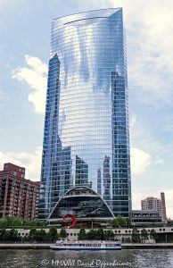 River Point at 444 West Lake Street Chicago River Point at 444 West Lake Street rises along the Chicago River in the West Loop, with a curved glass office tower facade, riverboat traffic, and riverfront public space visible in the foreground. Designed by Pickard Chilton with Kendall/Heaton Associates and developed by Hines, the Class A office skyscraper includes River Point Park and Santiago Calatrava’s Constellation sculpture on the riverfront – © 2026 David Oppenheimer – Performance Impressions photography archives https://performanceimpressions.com River Point 444 West Lake Street, River Point, River Point Chicago, River Point tower, River Point office tower, 444 West Lake Street, 444 W Lake Street, 444 W Lake St, 444 West Lake, 444 W Lake, 200 North Riverside Plaza, 200 N Riverside Plaza, West Loop Chicago, West Loop, downtown Chicago, Chicago Illinois, Chicago IL, West Lake Street, Lake Street, North Canal Street, Canal Street, Chicago River, river, riverfront, waterfront, Chicago riverfront, Chicago waterfront, South Branch Chicago River, River Point Park, riverfront park, public plaza, riverside plaza, riverwalk, Riverwalk, riverboat, river boat, boats, boat, water, waterway, 60606, facade, building exterior, exterior, glass facade, curved glass, curved facade, reflective glass, office tower, office building, commercial building, Class A office, skyscraper, high rise, tower, real estate, Chicago real estate, commercial real estate, office real estate, riverfront real estate, waterfront real estate, architecture, architectural photography, Chicago architecture, riverfront architecture, contemporary architecture, commercial architecture, Pickard Chilton, Kendall Heaton, Kendall Heaton Associates, Hines, Hines Interests, Ivanhoe Cambridge, Levy Organization, Lendlease, Magnusson Klemencic, Santiago Calatrava, Constellation sculpture, public art, sculpture, urban waterfront, urban design, Chicago skyline, Illinois architecture, United States, licensing, image licensing, commercial imagery, photography licensing, art, print, fine art, commercial photography, David Oppenheimer, vertical, 1-15156784411