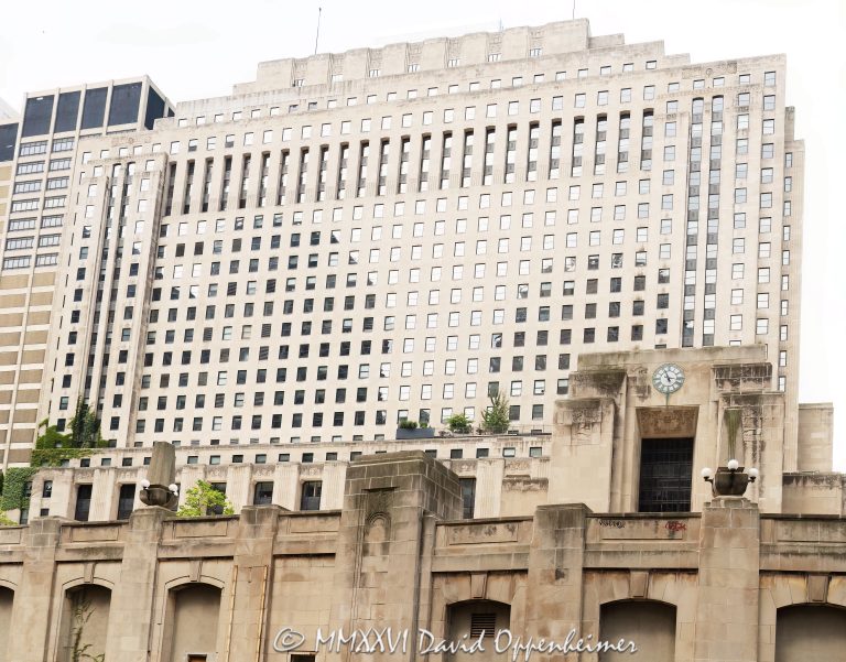 Riverside Plaza at 2 North Riverside Plaza in Chicago shows the Art Deco facade of the former Chicago Daily News Building, with limestone detailing, riverfront plaza architecture, and the Ogilvie Union water taxi area along the Chicago River. Designed by Holabird & Root for the Chicago Daily News, the historic office building remains one of Chicago’s best-known newspaper-era skyscrapers – © 2026 David Oppenheimer – Performance Impressions photography archives https://performanceimpressions.com Riverside Plaza, Riverside Plaza Chicago, 2 North Riverside Plaza, 2 N Riverside Plaza, 2 N Riverside Plz, Chicago Daily News Building, Chicago Daily News, Daily News Building, former Chicago Daily News Building, 400 W Madison Street, 400 West Madison Street, West Loop, West Loop Chicago, downtown Chicago, Chicago Illinois, Chicago IL, Chicago River, river, riverfront, waterfront, Chicago riverfront, Chicago waterfront, Ogilvie Union, Ogilvie Union ferry, Ogilvie Union water taxi, Chicago Water Taxi, water taxi, ferry terminal, boat dock, Madison Street Bridge, Canal Street, Washington Street, 60606, facade, building exterior, exterior, Art Deco, Art Deco facade, limestone facade, limestone, stone facade, sculpted facade, architectural detail, historic facade, office building, commercial building, newspaper building, newspaper headquarters, skyscraper, high rise, tower, plaza, public plaza, riverfront plaza, clock tower, clock towers, pylons, river pylons, architecture, architectural photography, Chicago architecture, Art Deco architecture, historic architecture, riverfront architecture, commercial architecture, Holabird & Root, Holabird and Root, Holabird & Roche, Holabird and Roche, Chicago Daily News developer, Walter A Strong, John W Norton, John Warner Norton, Printing the News, newspaper history, Chicago history, historic Chicago, Chicago journalism, Illinois architecture, United States, licensing, image licensing, commercial imagery, photography licensing, art, print, fine art, commercial photography, David Oppenheimer, horizontal, 1-15156784411