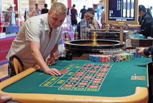 Roulette table at Wynn Las Vegas Resort and Casino in Las Vegas, Nevada - © 2025 David Oppenheimer - Performance Impressions casino photography archives - https://performanceimpressions.com Roulette table, Roulette, Wynn Casino, casino, Wynn roulette table, roulette wheel, dice, chips, casino chips, gaming, play, betting, odds, win, gambling, wager, bet, luck, gamble, 3355 S Las Vegas Blvd, 89109, Wynn, Encore, Encore Las Vegas, Encore Resort, Encore Casino, Encore Vegas, Encore at Wynn, Wynn Las Vegas, Wynn Vegas, Wynn Resort, Wynn Resorts, 3131 Las Vegas Blvd S, 89109, hotel, resort, building, architecture, shops, shopping, bridge, night, lights, city lights, WYNN, WYNN stock, five star, luxury, Las Vegas, Vegas, Las Vegas Strip, table game, dice game, casino floor, entertainment, luxury gaming, Nevada casino, vacation, escape, dream, fine art, artwork, Nevada, Nevada photography, colorful, wall art, United States, vertical, color, 1-14993092111