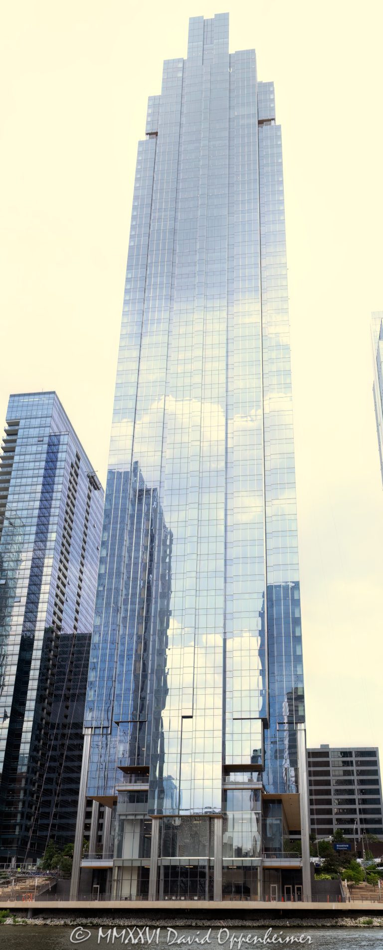 Salesforce Tower Chicago at 333 West Wolf Point Plaza rises above Chicago’s Wolf Point district, showing the tower’s curved glass facade and downtown office real estate presence. Designed by Pelli Clarke & Partners and developed by Hines with the Joseph P. Kennedy family, the office skyscraper was formerly known as Wolf Point South Tower and serves as Salesforce’s Chicago headquarters – © 2026 David Oppenheimer – Performance Impressions photography archives https://performanceimpressions.com Salesforce Tower Chicago, Salesforce Tower, Salesforce Chicago, Salesforce, Salesforce headquarters, Salesforce office, Salesforce building, Salesforce sign, 333 W Wolf Point Plaza, 333 West Wolf Point Plaza, 333 Wolf Point Plaza, Wolf Point South Tower, Wolf Point South, Wolf Point Chicago, Wolf Point, Wolf Point Plaza, River North, River North Chicago, Fulton River District, downtown Chicago, Chicago Illinois, Chicago IL, 60654, Chicago River, riverfront, Chicago riverfront, waterfront, Chicago waterfront, facade, building exterior, exterior, glass facade, curved glass, curved facade, reflective glass, building, tower, office tower, office building, commercial building, skyscraper, high rise, Class A office, trophy office, corporate office, corporate tower, real estate, Chicago real estate, commercial real estate, office real estate, riverfront real estate, waterfront real estate, business district, urban development, office development, architecture, architectural photography, Chicago architecture, contemporary architecture, commercial architecture, Pelli Clarke Pelli Architects, Pelli Clarke & Partners, Pelli Clarke and Partners, Hines, Hines Interests, Gerald D Hines Interests, Joseph P Kennedy family, Kennedy family, Wolf Point development, Wolf Point master plan, Salesforce Inc, CRM, technology company, cloud computing, software company, Chicago skyline, Illinois architecture, United States, licensing, image licensing, commercial imagery, photography licensing, art, print, fine art, commercial photography, David Oppenheimer, vertical, 1-15156784411