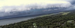 Arcus shelf cloud thunderstorm front squall line over Calibogue Sound by Hilton Head Island, South Carolina aerial view - © 2024 David Oppenheimer - Performance Impressions photography archives - https://performanceimpressions.com shelf cloud, clouds, cloud front, front, storm, wall, thunderstorm, storm front, squall line, arcus, arcus cloud, convection, weather, Hilton Head, Hilton Head Island, Hilton Head aerial, Hilton Head Island aerial, cumulonimbus, air, atmosphere, wind, downdraft, meteorology, Hilton Head storm, Hilton Head Island weather, Hilton Head weather, Hilton Head Island Storm, aviation, flying, turbulence, wind shear, offshore, safety, conditions, helicopter, flight, FAA, NCEP, pilots, FSS, METAR, SPECI, observation, visibility, ceiling, sky, operations, logistics, Calibogue Sound, Buck Island, Broad Creek, Comfort Creek, Lawton, Lawtown Creek, Shark Bank, Bull Island, Daufuskie Island, marsh, marshlands, Long Island, Calibogue Club, Sea Pines, Stoney Creek, Calibogue Club Villas, Sea Loft Villas, Sea Loft, Fairway Oaks Villas, Fairway Oaks, Plantation Club, Plantation Club Villas, Sea Pines Resort, beach, beach access, coast, South Carolina coast, coastal, shoreline, shore, shoreline aerial, waterfront, dunes, sand, beachfront, sand dunes, vacation, vacation homes, beach houses, houses, beach homes, summer, summer homes, residences, properties, Atlantic Ocean, Hilton Head, Hilton Head Island, Town of Hilton Head, South Carolina, coastline, coastline aerial, luxury, Lowcountry, Hilton head island real estate, Hilton Head real estate, real estate, Hilton Head aerial, aerial photographer, aerial photography, photography, aerial view, aerial, 29928, David Oppenheimer, David Gordon Oppenheimer, United States, color, horizontal, 1-13726821381,