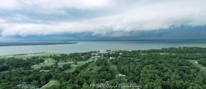Arcus shelf cloud thunderstorm front squall line over Calibogue Sound by Hilton Head Island, South Carolina aerial view - © 2024 David Oppenheimer - Performance Impressions photography archives - https://performanceimpressions.com shelf cloud, clouds, cloud front, front, storm, wall, thunderstorm, storm front, squall line, arcus, arcus cloud, convection, weather, Hilton Head, Hilton Head Island, Hilton Head aerial, Hilton Head Island aerial, cumulonimbus, air, atmosphere, wind, downdraft, meteorology, Hilton Head storm, Hilton Head Island weather, Hilton Head weather, Hilton Head Island Storm, aviation, flying, turbulence, wind shear, offshore, safety, conditions, helicopter, flight, FAA, NCEP, pilots, FSS, METAR, SPECI, observation, visibility, ceiling, sky, operations, logistics, Calibogue Sound, Buck Island, Broad Creek, Comfort Creek, Lawton, Lawtown Creek, Shark Bank, Bull Island, Daufuskie Island, marsh, marshlands, Long Island, Calibogue Club, Sea Pines, Stoney Creek, Calibogue Club Villas, Sea Loft Villas, Sea Loft, Fairway Oaks Villas, Fairway Oaks, Plantation Club, Plantation Club Villas, Sea Pines Resort, beach, beach access, coast, South Carolina coast, coastal, shoreline, shore, shoreline aerial, waterfront, dunes, sand, beachfront, sand dunes, vacation, vacation homes, beach houses, houses, beach homes, summer, summer homes, residences, properties, Atlantic Ocean, Hilton Head, Hilton Head Island, Town of Hilton Head, South Carolina, coastline, coastline aerial, luxury, Lowcountry, Hilton head island real estate, Hilton Head real estate, real estate, Hilton Head aerial, Harbour Town Lighthouse, Harbour Town, aerial photographer, aerial photography, photography, aerial view, aerial, 29928, David Oppenheimer, David Gordon Oppenheimer, United States, color, horizontal, 1-13726821381,