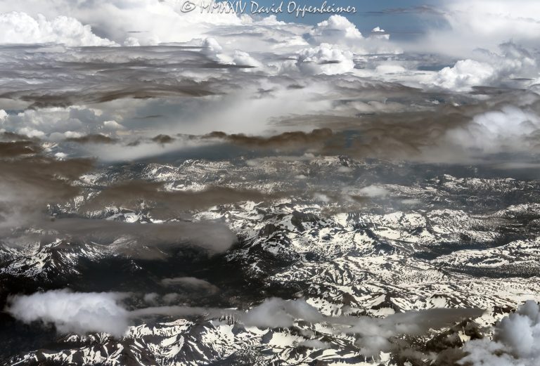 Sierra Nevada Mountains in California with snow and clouds aerial view - © 2024 David Oppenheimer - Performance Impressions aerial photography archives - https://performanceimpressions.com Sierra Nevada Mountains, Sierra Nevada, Sierra Nevada Mountains aerial, Sierra Nevada Mountain Range, Sierras, snow, clouds, snow cover, summer, snowpack, wilderness, nature, mountains, travel, altitude, mountain range, American Cordillera, watershed, Central Valley, California, beauty, elevation, climate, atmosphere, serene, art, aerial, aerial view, aerial photography, aerial photographer, David Oppenheimer, color, horizontal, United States, 1-13985601741,