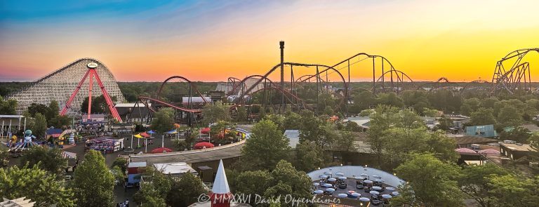 Six Flags Great America near Chicago in Gurnee, Illinois, viewed at sunset from the top of the Goliath roller coaster, with Sky Striker, American Eagle and X Flight prominent across the County Fair section of the amusement park. Giant Drop rises against the sunset sky, while Fiddler’s Fling, Raging Bull and part of Maxx Force are visible across the park – © 2026 David Oppenheimer – Performance Impressions photography archives https://performanceimpressions.com Six Flags Great America, Six Flags Great America sunset, Six Flags Great America view, Great America, Great America Illinois, Great America Chicago, Six Flags, Six Flags Illinois, Six Flags Chicago, Six Flags Great America Chicago, Goliath, Goliath roller coaster, Goliath Great America, Six Flags Goliath, Goliath coaster, Goliath view, view from Goliath, roller coaster view, coaster view, amusement park view, theme park view, park view, park overview, elevated view, sunset, sunset view, summer sunset, amusement park sunset, theme park sunset, orange sky, yellow sky, evening, summer, amusement park, theme park, amusement parks, theme parks, roller coaster, roller coasters, coaster, coasters, thrill ride, thrill rides, rides, attractions, amusement ride, theme park rides, coaster park, roller coaster park, thrill park, County Fair, County Fair Six Flags, County Fair rides, County Fair midway, midway, park midway, Sky Striker, Sky Striker ride, Six Flags Sky Striker, pendulum ride, pendulum, thrill ride, Zamperla, American Eagle, American Eagle coaster, American Eagle roller coaster, Six Flags American Eagle, Eagle, wooden coaster, wooden roller coaster, racing coaster, wooden racing coaster, roller coaster track, coaster track, lift hill, first drop, Intamin, X Flight, X Flight coaster, X Flight roller coaster, Six Flags X Flight, wing coaster, wing roller coaster, steel coaster, Bolliger & Mabillard, Bolliger Mabillard, B&M, B&M coaster, Giant Drop, Giant Drop ride, Six Flags Giant Drop, drop tower, drop ride, free fall, freefall ride, tower ride, tower, Fiddler’s Fling, Fiddlers Fling, Six Flags Fiddler’s Fling, spinning ride, flat ride, Schwarzkopf, Raging Bull, Raging Bull coaster, Raging Bull roller coaster, Six Flags Raging Bull, hypercoaster, hyper coaster, hyper-twister, steel roller coaster, Maxx Force, Maxx Force coaster, Maxx Force roller coaster, Six Flags Maxx Force, launched coaster, launch coaster, launched roller coaster, S&S, S&S Worldwide, Rocky Mountain Construction, RMC, RMC coaster, wooden coaster, coaster skyline, roller coaster skyline, amusement park skyline, theme park skyline, park skyline, ride skyline, amusement park landscape, theme park landscape, amusement park panorama, theme park panorama, panoramic view, wide angle, wide-angle, Gurnee, Gurnee Illinois, Gurnee IL, Illinois, northern Illinois, Lake County, Lake County Illinois, Chicagoland, Chicago area, Chicago suburbs, Chicago, Milwaukee area, Great America Parkway, 1 Great America Parkway, Grand Avenue, Route 132, Interstate 94, I-94, 60031, Chicago attraction, Chicago attractions, Illinois attraction, Illinois attractions, Gurnee attraction, Gurnee tourism, Illinois tourism, Chicago tourism, Chicago travel, Illinois travel, Visit Chicago, visit Chicago, Visit Illinois, family attraction, family entertainment, family fun, vacation, summer vacation, road trip, Midwest travel, Midwest attraction, Midwest amusement park, Midwest theme park, United States, USA, Six Flags Entertainment Corporation, Six Flags Entertainment, Six Flags company, NYSE FUN, FUN, Six Flags stock, Cedar Fair, Marriott’s Great America, Marriotts Great America, Marriott Great America, Marriott Corporation, amusement park photography, theme park photography, roller coaster photography, coaster photography, sunset photography, travel photography, tourism photography, landscape photography, editorial photography, commercial photography, fine art photography, Six Flags photography, Great America photography, Goliath photography, amusement park art, theme park art, roller coaster art, Six Flags art, Great America art, amusement park print, theme park print, roller coaster print, Six Flags print, photographic print, fine art print, archival print, gallery print, collector print, wall art, licensing, image licensing, commercial imagery, photography licensing, art, print, fine art, commercial photography, David Oppenheimer, Performance Impressions, Performance Impressions photography archives, horizontal, 1-15213827141