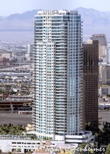 Sky Las Vegas condominium tower at 2700 Las Vegas Blvd S on the Las Vegas Strip, a 45-story residential high-rise designed by Klai Juba Architects and built by M.J. Dean Construction, developed by Nevada Development Partners, completed in 2007. The 500-foot tower features luxury condominiums with private balconies, pool deck, and modern amenities — aerial view – © 2025 David Oppenheimer – Performance Impressions aerial photography archives – https://performanceimpressions.com The Metropolis LaSky Las Vegas, Sky Tower Las Vegas, 2700 Las Vegas Blvd S, Las Vegas Strip, Las Vegas, Nevada, Winchester, high rise, high-rise, condominium tower, condo tower, luxury condos, residential tower, balconies, architecture, architectural, Klai Juba, Klai Juba Wald, M.J. Dean Construction, Nevada Development Partners, Milbank Real Estate, Sahara, near Sahara, skyline, cityscape, tower, 45 story, 500 ft, elevation, aerial, aerial view, helicopter view, urban, urban landscape, real estate, residences, modernism, contemporary architecture, strip corridor, residential high rise, luxury living, amenities deck, pool deck, Las Vegas Boulevard, Paradise, Clark County, United States, USA, night lights, city lights, neon, desert city, south Strip, Nevada architecture, vertical, color, 1-14993092111