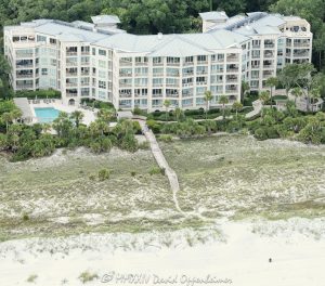 Somerset Villas at Palmetto Dunes at 164 S Shore Dr, on Hilton Head Island, South Carolina, aerial view - © 2024 David Oppenheimer - Performance Impressions aerial photography archives - https://performanceimpressions.com Somerset Villas at Palmetto Dunes, Somerset Villas, Somerset Villas at Palmetto Dunes aerial, Palmetto Dunes, Somerset, building, architecture, villas, condos, apartments, 164 S Shore Dr, pool, furnished, beach, beach access, coast, South Carolina coast, coastal, shoreline, shore, shoreline aerial, waterfront, dunes, sand, beachfront, sand dunes, resort, vacation, vacation homes, beach houses, houses, beach homes, summer, summer homes, residences, properties, Atlantic Ocean, Hilton Head, Hilton Head Island, Town of Hilton Head, South Carolina, coastline, luxury, Lowcountry, Hilton head island real estate, Hilton Head real estate, real estate, Hilton Head aerial, aerial photographer, aerial photography, photography, aerial view, aerial, 29928, David Oppenheimer, David Gordon Oppenheimer, United States, color, vertical, 1-13726821381,