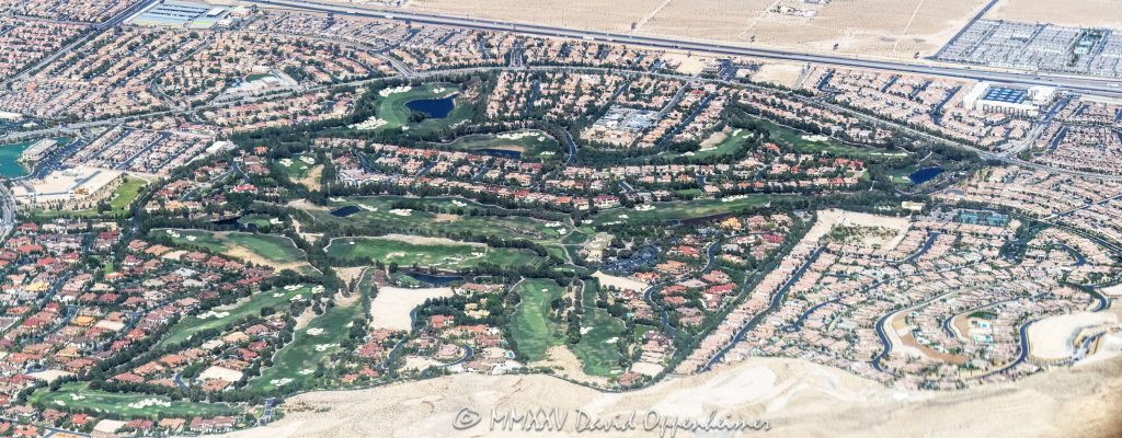 Southern Highlands Las Vegas Golf Community Aerial View Southern Highlands master-planned community and Southern Highlands Golf Club in Enterprise, Clark County, Nevada – featuring lush fairways, rolling greens, landscaped roads, gated neighborhoods, water features, and golf course terrain – aerial view – © 2025 David Oppenheimer – Performance Impressions aerial photography archives – https://performanceimpressions.com Southern Highlands, Southern Highlands Golf Club, master-planned community, gated community, luxury residential, championship, golf course, Las Vegas golf, Robert Trent Jones Sr., Robert Trent Jones Jr., Olympia Companies, Enterprise, Las Vegas Valley, Clark County, Nevada, homes, estates, fairways, greens, bunkers, water features, rolling terrain, landscaped roads, golfing, Vegas golf, golf community, residential development, private club, golf lifestyle, sports, recreation, outdoor sports, golfers, residences, residential, community layout, amenities, parks, tennis courts, walking paths, mountain views, desert setting, desert landscape, aerial, aerial view, horizontal, color, gated estates, real estate, neighborhood, green spaces, luxury homes, 1-14993092111
