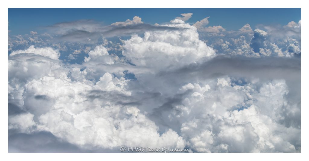 Summer clouds aerial photo showing towering cumulus clouds, developing cumulonimbus formations, and layered cloud tops against blue sky, emphasizing atmospheric texture, convective weather, cloud structure, and high-altitude meteorology – © 2026 David Oppenheimer – Performance Impressions aerial photography archives https://performanceimpressions.com summer clouds aerial photo, summer clouds, clouds aerial view, aerial clouds, cloudscape, cloudscape aerial, cloud formations, cloud tops, cloud layer, towering clouds, cumulus clouds, cumulus, cumulus congestus, cumulonimbus, cumulonimbus clouds, thunderstorm clouds, storm clouds, developing storm, convective clouds, convection, atmospheric convection, weather, meteorology, atmosphere, atmospheric, sky, blue sky, white clouds, cloud texture, cloud structure, cloud field, cloud cover, cloud mass, cloud bank, cloudscape photography, aerial, aerial photo, aerial photography, aerial photographer, aerial view, aerial image, high altitude, altitude, aviation, airplane view, flight, travel, summer weather, weather pattern, weather system, storm development, thunderstorm, rain clouds, moisture, humidity, vapor, water vapor, atmosphere science, weather science, meteorological, natural pattern, nature, outdoors, environment, climate, climate imagery, abstract nature, atmospheric layers, scenic sky, sky photography, United States, licensing, image licensing, commercial imagery, photography licensing, art, print, fine art, commercial photography, David Oppenheimer, horizontal, 1-15156784411