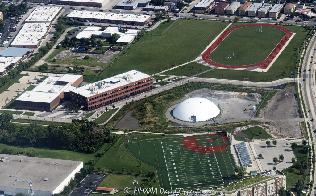 Taft Freshman Academy in Chicago aerial photo showing the full school campus, athletic track, multi-use sports field, school buildings, and surrounding Dunning neighborhood. Located at 4071 North Oak Park Avenue, the campus is part of William Howard Taft High School and was initially referred to as Read Dunning School during development – © 2026 David Oppenheimer – Performance Impressions aerial photography archives https://performanceimpressions.com Taft Freshman Academy, Taft Freshman Academy Chicago, Taft Freshman Academy campus, Taft Freshman Academy aerial, Taft Freshman Academy field, Taft Freshman Academy track, Taft Freshman Academy athletics, William Howard Taft High School, Taft High School, Taft High School Chicago, Taft High School campus, Taft High School athletics, 4071 N Oak Park Ave, 4071 North Oak Park Avenue, North Oak Park Avenue, Oak Park Avenue, Read Dunning School, Read Dunning, Dunning Field, Dunning, Dunning Chicago, Chicago Public Schools, CPS, Chicago school, public school, freshman academy, high school, school, campus, education, athletics, athletic field, sports field, multi use field, football field, soccer field, playing field, field, track, running track, athletic track, school track, stadium, bleachers, sports, recreation, outdoor sports, aerial, aerial photo, aerial photography, aerial photographer, aerial view, aerial image, school aerial, campus aerial, sports aerial, Chicago aerial, Northwest Side Chicago, Northwest Side, Chicago neighborhood, urban campus, school campus, school building, educational facility, STL Architects, Public Building Commission, PBC Chicago, Dunning neighborhood, Chicago Illinois, Chicago IL, 60634, United States, licensing, image licensing, commercial imagery, photography licensing, art, print, fine art, commercial photography, David Oppenheimer, horizontal, 1-15156784411