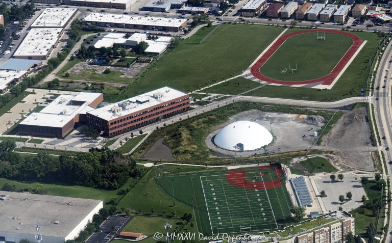 Taft Freshman Academy in Chicago aerial photo showing the full school campus, athletic track, multi-use sports field, school buildings, and surrounding Dunning neighborhood. Located at 4071 North Oak Park Avenue, the campus is part of William Howard Taft High School and was initially referred to as Read Dunning School during development – © 2026 David Oppenheimer – Performance Impressions aerial photography archives https://performanceimpressions.com Taft Freshman Academy, Taft Freshman Academy Chicago, Taft Freshman Academy campus, Taft Freshman Academy aerial, Taft Freshman Academy field, Taft Freshman Academy track, Taft Freshman Academy athletics, William Howard Taft High School, Taft High School, Taft High School Chicago, Taft High School campus, Taft High School athletics, 4071 N Oak Park Ave, 4071 North Oak Park Avenue, North Oak Park Avenue, Oak Park Avenue, Read Dunning School, Read Dunning, Dunning Field, Dunning, Dunning Chicago, Chicago Public Schools, CPS, Chicago school, public school, freshman academy, high school, school, campus, education, athletics, athletic field, sports field, multi use field, football field, soccer field, playing field, field, track, running track, athletic track, school track, stadium, bleachers, sports, recreation, outdoor sports, aerial, aerial photo, aerial photography, aerial photographer, aerial view, aerial image, school aerial, campus aerial, sports aerial, Chicago aerial, Northwest Side Chicago, Northwest Side, Chicago neighborhood, urban campus, school campus, school building, educational facility, STL Architects, Public Building Commission, PBC Chicago, Dunning neighborhood, Chicago Illinois, Chicago IL, 60634, United States, licensing, image licensing, commercial imagery, photography licensing, art, print, fine art, commercial photography, David Oppenheimer, horizontal, 1-15156784411