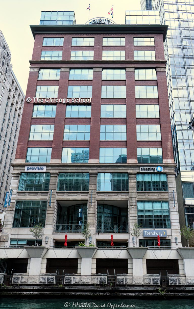 The Chicago School Building at 325 North Wells Street in River North shows the river-facing brick and glass facade of the former Chase & Sanborn Coffee warehouse, now home to The Chicago School’s Chicago campus and office showroom tenants including Provisio, Allseating, and Trendway. The building sits along the Chicago River near the Merchandise Mart and downtown Chicago – © 2026 David Oppenheimer – Performance Impressions photography archives https://performanceimpressions.com The Chicago School Building, The Chicago School, Chicago School Building, Chicago School Chicago, Chicago School campus, The Chicago School Chicago, The Chicago School of Professional Psychology, Chicago School of Professional Psychology, 325 N Wells Street, 325 North Wells Street, 325 N Wells St, North Wells Street, Wells Street, River North, River North Chicago, downtown Chicago, Chicago Illinois, Chicago IL, 60654, Chicago River, river, riverfront, waterfront, Chicago riverfront, Chicago waterfront, Merchandise Mart, Mart, facade, building exterior, exterior, brick facade, glass facade, brick building, glass, brick, commercial building, office building, education, university, college, campus, psychology school, graduate school, private university, higher education, behavioral sciences, professional psychology, former warehouse, warehouse building, Chase and Sanborn, Chase & Sanborn, Chase and Sanborn Coffee, coffee warehouse, Provisio, Provisio Partners, Allseating, Allseating Chicago, Trendway, office furniture, furniture showroom, showroom, office showroom, commercial interiors, workplace design, River North real estate, Chicago real estate, commercial real estate, architecture, architectural photography, Chicago architecture, commercial architecture, adaptive reuse, historic Chicago, urban campus, Illinois architecture, United States, licensing, image licensing, commercial imagery, photography licensing, art, print, fine art, commercial photography, David Oppenheimer, vertical, 1-15156784411