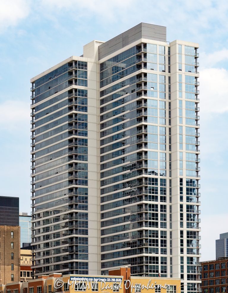 The Elle Apartments at 801 South Financial Place rises in Chicago’s South Loop, showing the high-rise residential facade of a luxury rental apartment tower near Roosevelt Collection, Grant Park, and the downtown real estate corridor. Designed by Pappageorge Haymes Partners and developed by Wood Partners, the building was originally marketed during development as Alta Roosevelt – © 2026 David Oppenheimer – Performance Impressions photography archives https://performanceimpressions.com The Elle Apartments, The Elle Chicago, The Elle Apartments Chicago, Elle Apartments, Elle Apartments Chicago, 801 S Financial Pl, 801 South Financial Place, 801 S Financial Place, 801 South Financial, Alta Roosevelt, Alta Roosevelt Chicago, South Loop, South Loop Chicago, downtown Chicago, Chicago Illinois, Chicago IL, 60605, Financial Place, South Financial Place, Roosevelt Road, Roosevelt Collection, Grant Park, Printer’s Row, Dearborn Park, Museum Campus, Soldier Field, facade, building exterior, exterior, residential facade, glass facade, high rise, tower, apartment tower, residential tower, apartment building, residential building, luxury apartments, rental apartments, apartments, rentals, housing, residential housing, real estate, Chicago real estate, South Loop real estate, residential real estate, apartment rentals, Chicago apartments, South Loop apartments, luxury rentals, apartment living, urban living, city living, downtown apartments, amenities, outdoor deck, pool, cabanas, coworking, theater, pet friendly, architecture, architectural photography, Chicago architecture, residential architecture, contemporary architecture, commercial architecture, Pappageorge Haymes Partners, Pappageorge Haymes, Wood Partners, Walsh Construction, luxury residential, Illinois architecture, United States, licensing, image licensing, commercial imagery, photography licensing, art, print, fine art, commercial photography, David Oppenheimer, vertical, 1-15156784411