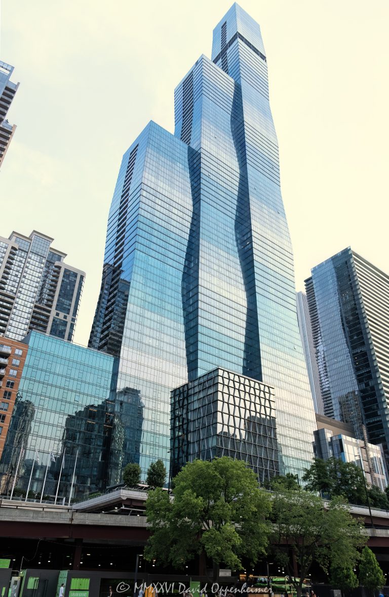 The St. Regis Chicago at 401 East Upper Wacker Drive rises above Lakeshore East as a 101-story luxury hotel and condominium tower viewed from the Chicago River. Designed by Jeanne Gang of Studio Gang, its three interconnected volumes and graduated blue-green glass curtain wall create a sculptural profile near Lake Michigan in Chicago, Illinois – © 2026 David Oppenheimer – Performance Impressions photography archives https://performanceimpressions.com The St. Regis Chicago, St. Regis Chicago, The St. Regis Chicago Hotel, St. Regis Hotel Chicago, St. Regis Chicago Residences, The Residences at The St. Regis Chicago, St. Regis Hotels & Resorts, 401 East Upper Wacker Drive, 401 E Upper Wacker Drive, 401 E Wacker Drive, 363 East Wacker Drive, 363 E Wacker Drive, Vista Tower, Vista Tower Chicago, Wanda Vista Tower, Lakeshore East, Lakeshore East Chicago, New Eastside, Chicago Loop, Loop Chicago, downtown Chicago, East Wacker Drive, Upper Wacker Drive, Wacker Drive, Chicago River, Chicago Riverwalk, Riverwalk, riverfront, Lake Michigan, Chicago lakefront, DuSable Harbor, Navy Pier, Millennium Park, Magnificent Mile, Chicago, Chicago Illinois, Chicago IL, Illinois, 60601, facade, building exterior, exterior, tower exterior, upper tower, glass facade, glass tower, glass skyscraper, glass curtain wall, curtain wall, gradient glass, blue-green glass, aqua glass, reflective glass, high-performance glass, faceted facade, geometric facade, undulating facade, sculptural facade, three-volume tower, interconnected volumes, three interconnected towers, frustum, frustum geometry, truncated pyramid, stacked frustums, stepped edges, tapered tower, contemporary architecture, modern architecture, sculptural architecture, high-rise architecture, riverfront architecture, Chicago architecture, architectural photography, luxury hotel, five-star hotel, Chicago hotel, Chicago luxury hotel, downtown hotel, downtown Chicago hotel, riverfront hotel, Lake Michigan hotel, Marriott hotel, hotel tower, hotel, hospitality, luxury hospitality, Marriott Bonvoy, Marriott International, Marriott stock, NASDAQ MAR, MAR stock, mixed-use tower, mixed-use building, condominium tower, residential tower, condominiums, luxury condos, luxury residences, Chicago condos, Lakeshore East condos, skyscraper, supertall, high rise, tower, building, 101-story tower, Chicago skyline, city views, river views, lake views, real estate, Chicago real estate, Lakeshore East real estate, hotel real estate, hospitality real estate, condominium real estate, residential real estate, luxury real estate, riverfront real estate, commercial real estate, Studio Gang, Jeanne Gang, bKL Architecture, bKL Architects, Gensler, HBA, Magnusson Klemencic Associates, MKA, McHugh Construction, Power Construction, OLIN, Magellan Development Group, Gencom, GD Holdings, hotel ownership, hotel investment, daytime, white sky, bright sky, soft light, boat view, river view, Chicago River cruise, architecture cruise, United States, licensing, image licensing, commercial imagery, photography licensing, art, print, fine art, commercial photography, David Oppenheimer, vertical, 1-15213827141