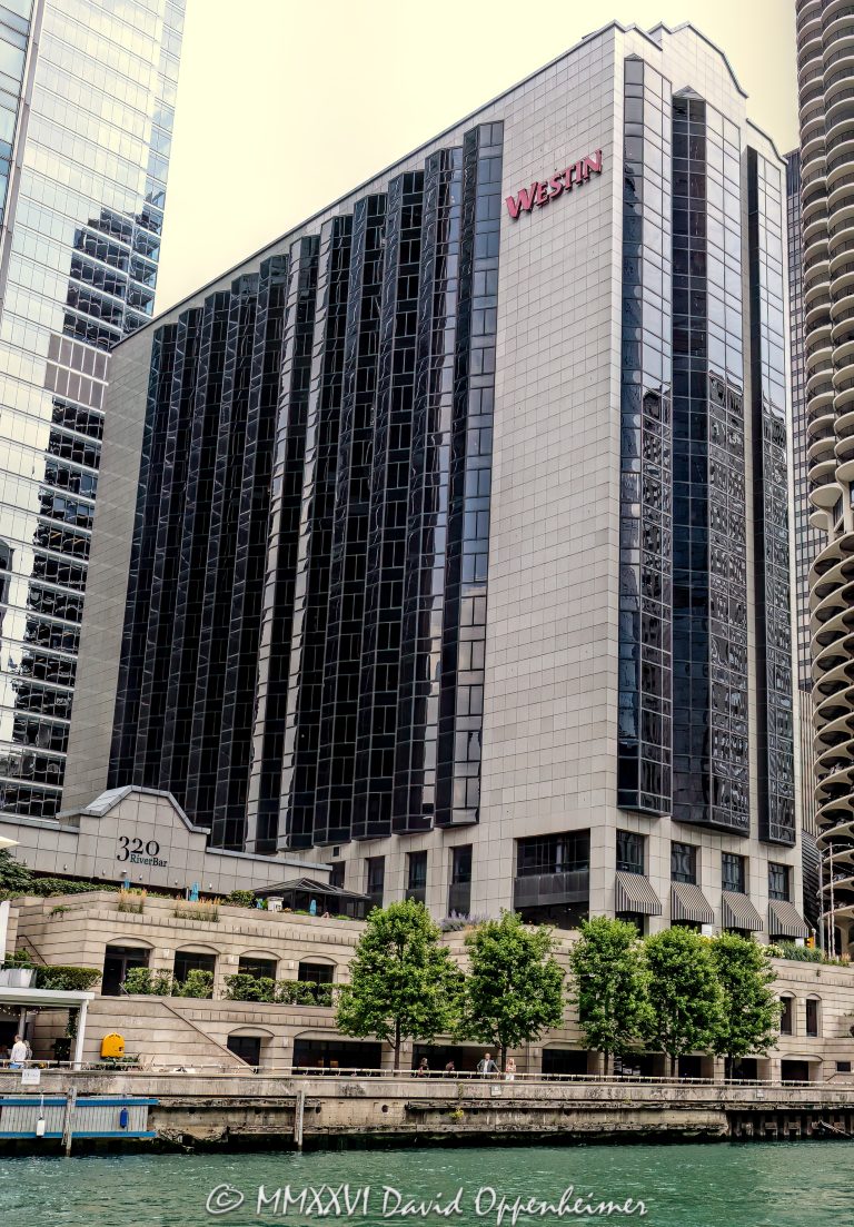The Westin Chicago River North at 320 North Dearborn Street stands along the Chicago River in the River North business district, showing the hotel’s riverfront facade and downtown hospitality setting. Operated under Marriott International’s Westin brand, the former Hotel Nikko Chicago includes 320 RiverBar and is positioned for business travel, meetings, dining, and riverfront hotel stays – © 2026 David Oppenheimer – Performance Impressions photography archives https://performanceimpressions.com The Westin Chicago River North, Westin Chicago River North, Westin River North, Westin River North Chicago, The Westin River North Chicago, 320 N Dearborn Street, 320 North Dearborn Street, 320 N Dearborn St, North Dearborn Street, Dearborn Street, Hotel Nikko Chicago, former Hotel Nikko, Hotel Nikko, Marriott, Marriott International, Marriott Bonvoy, Westin, Westin Hotels, Westin brand, 320 RiverBar, 320 River Bar, RiverBar, Kamehachi, River North, River North Chicago, downtown Chicago, Chicago Illinois, Chicago IL, 60654, Chicago River, river, riverfront, waterfront, water, Chicago riverfront, Chicago waterfront, Riverwalk, Chicago Riverwalk, riverfront hotel, waterfront hotel, Chicago River hotel, downtown hotel, Chicago hotel, business hotel, convention hotel, meeting hotel, hotel, hotels, hospitality, travel, tourism, business travel, facade, building exterior, exterior, hotel facade, glass facade, modern facade, tower, hotel tower, high rise, commercial building, real estate, Chicago real estate, hotel real estate, riverfront real estate, waterfront real estate, architecture, architectural photography, Chicago architecture, riverfront architecture, commercial architecture, postmodern architecture, Host Hotels, Host Hotels & Resorts, 320 Restaurant, dining, restaurant, bar, river view, river views, Illinois architecture, United States, licensing, image licensing, commercial imagery, photography licensing, art, print, fine art, commercial photography, David Oppenheimer, vertical, 1-15156784411
