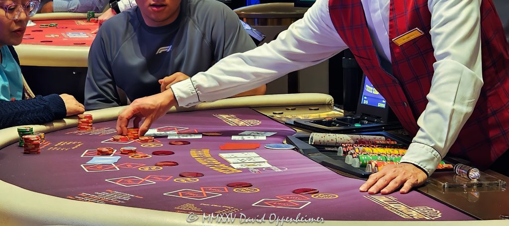 Three Card Poker Table Gambling at The Venetian Casino in Las Vegas Three Card Poker table gambling at The Venetian casino in Las Vegas, Nevada - © 2025 David Oppenheimer - Performance Impressions casino photography archives - https://performanceimpressions.com Three Card Poker, Three Card Poker table, Three Card Poker Vegas, Three Card Poker gambling, Poker, Poker table, The Venetian, casino, Las Vegas, cards, card game, chips, Venetian casino, casino chips, money, draw, draw of the cards, table, gaming, play, Nevada, odds, win, gambling, dealer, Poker dealer, hand, shuffle, shoe, casino floor, table game, nightlife, entertainment, casino resort, wager, bet, luck, gamble, resort, 3355 S Las Vegas Blvd, 89109, United States, horizontal, color, 1-14977862771