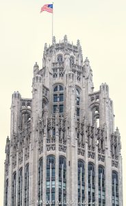 Tribune Tower in Chicago Tribune Tower at 435 North Michigan Avenue in Chicago shows the ornate neo-Gothic tower, limestone facade, Gothic crown, and architectural detailing of the former Chicago Tribune headquarters. Designed by John Mead Howells and Raymond Hood, the landmark tower has been converted into Tribune Tower Residences, a luxury condominium property developed by CIM Group and Golub & Company, with Rowan visible at Michigan Avenue street level – © 2026 David Oppenheimer – Performance Impressions photography archives https://performanceimpressions.com Tribune Tower, Tribune Tower Chicago, Tribune Tower Residences, Tribune Tower condos, Tribune Tower condominiums, 435 N Michigan Ave, 435 North Michigan Avenue, 435 N Michigan Avenue, North Michigan Avenue, Michigan Avenue, Magnificent Mile, Mag Mile, Chicago Loop, Streeterville, downtown Chicago, Chicago Illinois, Chicago IL, 60611, facade, building exterior, exterior, tower, Gothic tower, neo-Gothic tower, ornate tower, limestone facade, stone facade, Gothic facade, neo-Gothic facade, Gothic crown, architectural detail, ornate facade, historic facade, carved stone, buttresses, tracery, skyscraper, high rise, landmark building, Chicago Landmark, historic building, newspaper building, former headquarters, Chicago Tribune, Chicago Tribune Tower, Tribune Company, Tribune Media, Tribune Publishing, WGN Radio, real estate, Chicago real estate, luxury real estate, residential real estate, condominium tower, condo tower, luxury condos, condominiums, luxury residences, residential conversion, adaptive reuse, architecture, architectural photography, Chicago architecture, historic architecture, Gothic architecture, Gothic Revival, neo-Gothic architecture, commercial architecture, residential architecture, John Mead Howells, Raymond Hood, Howells and Hood, Howells & Hood, Rene Paul Chambellan, CIM Group, Golub and Company, Golub & Company, Rowan, Rowan Michigan Ave, Rowan Chicago, Tower District, Michigan Avenue retail, Chicago history, journalism history, Illinois architecture, United States, licensing, image licensing, commercial imagery, photography licensing, art, print, fine art, commercial photography, David Oppenheimer, vertical, 1-15213827141