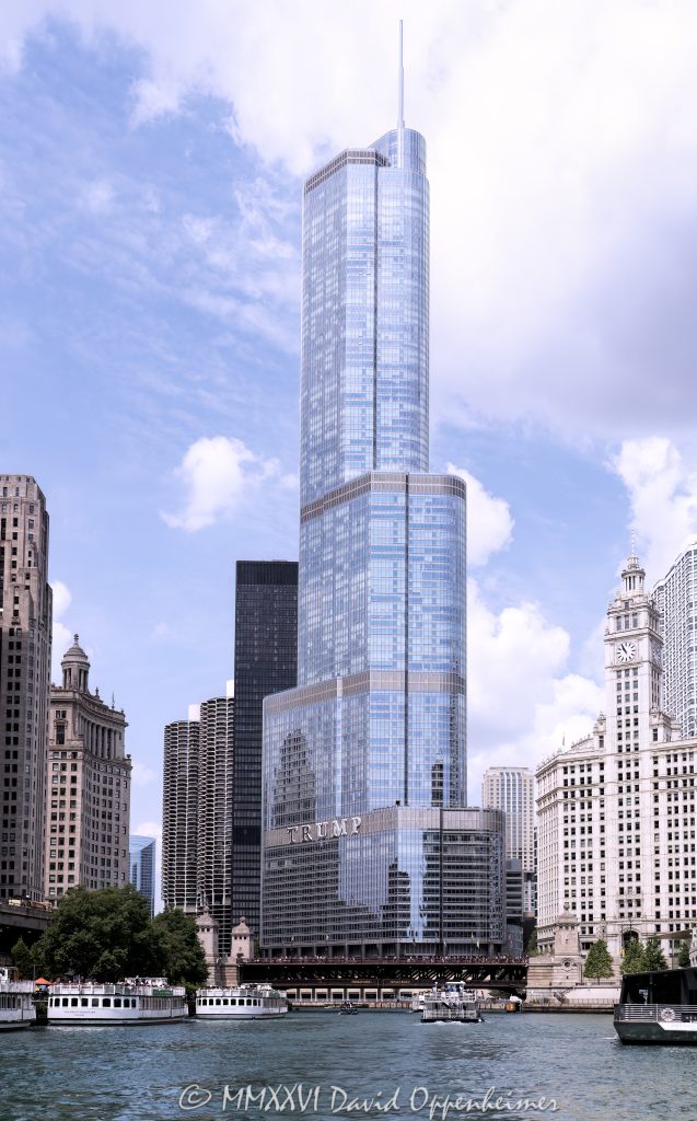 Trump International Hotel and Tower Chicago at 401 North Wabash Avenue rises along the Chicago River in River North, with the river and Wendella West Docks visible in the foreground. Designed by Skidmore, Owings & Merrill with Adrian Smith as lead architect and structural engineering by William F. Baker, the glass and stainless-steel mixed-use skyscraper includes hotel rooms, condominiums, retail space, and parking – © 2026 David Oppenheimer – Performance Impressions photography archives https://performanceimpressions.com