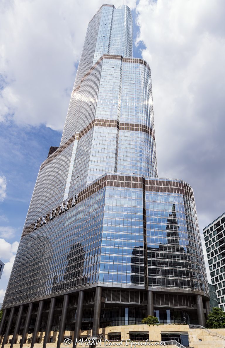 Trump International Hotel and Tower Chicago at 401 North Wabash Avenue rises in River North, showing the glass and stainless-steel facade of the mixed-use hotel and condominium skyscraper. Designed by Skidmore, Owings & Merrill with Adrian Smith as lead architect and structural engineering by William F. Baker, the tower includes hotel rooms, condominiums, retail space, and parking – © 2026 David Oppenheimer – Performance Impressions photography archives https://performanceimpressions.com Trump International Hotel and Tower Chicago, Trump International Hotel & Tower Chicago, Trump International Hotel and Tower, Trump International Hotel & Tower, Trump Tower Chicago, Trump Tower, Trump Chicago, 401 N Wabash Avenue, 401 North Wabash Avenue, 401 N Wabash Ave, 401 N Wabash, North Wabash Avenue, Wabash Avenue, River North, River North Chicago, Near North Side, downtown Chicago, Chicago Illinois, Chicago IL, 60611, Chicago River, Chicago riverfront, facade, building exterior, exterior, hotel facade, glass facade, stainless steel facade, stainless steel, reflective glass, glass tower, Trump sign, building, tower, hotel tower, condo tower, condominium tower, residential tower, skyscraper, supertall, high rise, mixed use tower, mixed use building, condo hotel, hotel, luxury hotel, five star hotel, condominiums, condos, luxury condos, luxury residences, residences, real estate, Chicago real estate, luxury real estate, hotel real estate, residential real estate, commercial real estate, architecture, architectural photography, Chicago architecture, contemporary architecture, hotel architecture, residential architecture, commercial architecture, Skidmore Owings Merrill, Skidmore Owings & Merrill, SOM, Adrian Smith, William F Baker, William F. Baker, Donald Trump, President Trump, Trump Organization, Bovis Lend Lease, Illinois architecture, United States, licensing, image licensing, commercial imagery, photography licensing, art, print, fine art, commercial photography, David Oppenheimer, vertical, 1-15156784411
