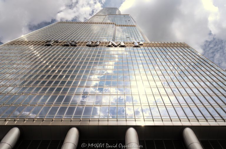 Trump International Hotel and Tower Chicago at 401 North Wabash Avenue rises in River North, showing the glass and stainless-steel facade of the mixed-use hotel and condominium skyscraper. Designed by Skidmore, Owings & Merrill with Adrian Smith as lead architect and structural engineering by William F. Baker, the tower includes hotel rooms, condominiums, retail space, and parking – © 2026 David Oppenheimer – Performance Impressions photography archives https://performanceimpressions.com Trump International Hotel and Tower Chicago, Trump International Hotel & Tower Chicago, Trump International Hotel and Tower, Trump International Hotel & Tower, Trump Tower Chicago, Trump Tower, Trump Chicago, 401 N Wabash Avenue, 401 North Wabash Avenue, 401 N Wabash Ave, 401 N Wabash, North Wabash Avenue, Wabash Avenue, River North, River North Chicago, Near North Side, downtown Chicago, Chicago Illinois, Chicago IL, 60611, Chicago River, Chicago riverfront, facade, building exterior, exterior, hotel facade, glass facade, stainless steel facade, stainless steel, reflective glass, glass tower, Trump sign, building, tower, hotel tower, condo tower, condominium tower, residential tower, skyscraper, supertall, high rise, mixed use tower, mixed use building, condo hotel, hotel, luxury hotel, five star hotel, condominiums, condos, luxury condos, luxury residences, residences, real estate, Chicago real estate, luxury real estate, hotel real estate, residential real estate, commercial real estate, architecture, architectural photography, Chicago architecture, contemporary architecture, hotel architecture, residential architecture, commercial architecture, Skidmore Owings Merrill, Skidmore Owings & Merrill, SOM, Adrian Smith, William F Baker, William F. Baker, Donald Trump, President Trump, Trump Organization, Bovis Lend Lease, Illinois architecture, United States, licensing, image licensing, commercial imagery, photography licensing, art, print, fine art, commercial photography, David Oppenheimer, horizontal, 1-15156784411