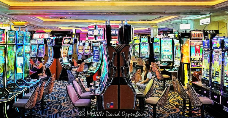 Slot machines at The Venetian Resort casino in Las Vegas, Nevada - © 2025 David Oppenheimer - Performance Impressions casino photography archives - https://performanceimpressions.com slot machines, slots, lights, lighting, casino lights, machines, The Venetian, Venetian, Venetian casino, gaming, casino, Las Vegas, Nevada, slots, odds, win, gambling, wager, bet, luck, jackpot, gamble, one-armed bandit, hotel, quick spin, resort, American Gaming Association, AGA, 3355 S Las Vegas Blvd, 89109, bright, colorful, carpet, art, casino art, painting, United States, horizontal, color, 1-14977862771