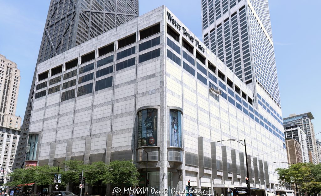 Water Tower Place at 835 North Michigan Avenue anchors the Magnificent Mile with its gray marble-clad mixed-use tower rising above the multi-level shopping center. Designed by Edward D. Dart of Loebl, Schlossman, Bennett & Dart, the development combines retail with The Ritz-Carlton, Chicago and luxury residences in Chicago, Illinois – © 2026 David Oppenheimer – Performance Impressions photography archives https://performanceimpressions.com Water Tower Place, Water Tower Place Chicago, Water Tower Place mall, Water Tower Place shopping center, Water Tower Place tower, 835 North Michigan Avenue, 835 N Michigan Avenue, North Michigan Avenue, Michigan Avenue, Magnificent Mile, Mag Mile, Streeterville, Streeterville Chicago, Near North Side, downtown Chicago, Chicago, Chicago Illinois, Chicago IL, Illinois, 60611, facade, building exterior, exterior, retail facade, shopping center exterior, mall exterior, tower, high rise, skyscraper, mixed use, mixed-use development, mixed-use tower, retail, shopping, shopping mall, shopping center, retail center, vertical mall, urban mall, Michigan Avenue shopping, Chicago shopping, Magnificent Mile shopping, retail architecture, commercial architecture, residential architecture, hotel architecture, architecture, architectural photography, Chicago architecture, modern architecture, modernist architecture, marble facade, marble clad, gray marble, stone facade, concrete tower, reinforced concrete, retail podium, podium, architectural detail, urban architecture, commercial building, retail building, landmark building, Chicago landmark, luxury retail, luxury shopping, tourism, Chicago tourism, retail destination, The Ritz-Carlton Chicago, Ritz-Carlton Chicago, Ritz-Carlton, luxury hotel, Chicago hotel, condominiums, condos, luxury condos, luxury residences, residential tower, Water Tower Place condos, Water Tower Place residences, Edward D Dart, Edward Dart, Loebl Schlossman Bennett & Dart, Loebl Schlossman Bennett and Dart, C F Murphy & Associates, CF Murphy Associates, JMB, JMB Realty, Urban Investment and Development Company, Urban Retail Properties, Inland Robbins Construction, MetLife Investment Management, MetLife, MetLife Inc, NYSE MET, MET stock, M & J Wilkow, M J Wilkow, Brookfield Properties, General Growth Properties, Rouse Company, Chicago real estate, commercial real estate, retail real estate, luxury real estate, Illinois architecture, United States, licensing, image licensing, commercial imagery, photography licensing, art, print, fine art, commercial photography, David Oppenheimer, horizontal, 1-15213827141