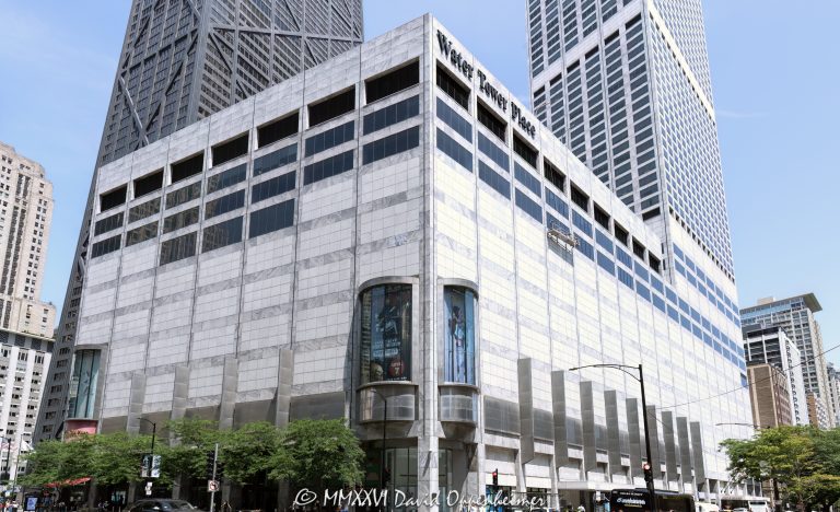 Water Tower Place at 835 North Michigan Avenue anchors the Magnificent Mile with its gray marble-clad mixed-use tower rising above the multi-level shopping center. Designed by Edward D. Dart of Loebl, Schlossman, Bennett & Dart, the development combines retail with The Ritz-Carlton, Chicago and luxury residences in Chicago, Illinois – © 2026 David Oppenheimer – Performance Impressions photography archives https://performanceimpressions.com Water Tower Place, Water Tower Place Chicago, Water Tower Place mall, Water Tower Place shopping center, Water Tower Place tower, 835 North Michigan Avenue, 835 N Michigan Avenue, North Michigan Avenue, Michigan Avenue, Magnificent Mile, Mag Mile, Streeterville, Streeterville Chicago, Near North Side, downtown Chicago, Chicago, Chicago Illinois, Chicago IL, Illinois, 60611, facade, building exterior, exterior, retail facade, shopping center exterior, mall exterior, tower, high rise, skyscraper, mixed use, mixed-use development, mixed-use tower, retail, shopping, shopping mall, shopping center, retail center, vertical mall, urban mall, Michigan Avenue shopping, Chicago shopping, Magnificent Mile shopping, retail architecture, commercial architecture, residential architecture, hotel architecture, architecture, architectural photography, Chicago architecture, modern architecture, modernist architecture, marble facade, marble clad, gray marble, stone facade, concrete tower, reinforced concrete, retail podium, podium, architectural detail, urban architecture, commercial building, retail building, landmark building, Chicago landmark, luxury retail, luxury shopping, tourism, Chicago tourism, retail destination, The Ritz-Carlton Chicago, Ritz-Carlton Chicago, Ritz-Carlton, luxury hotel, Chicago hotel, condominiums, condos, luxury condos, luxury residences, residential tower, Water Tower Place condos, Water Tower Place residences, Edward D Dart, Edward Dart, Loebl Schlossman Bennett & Dart, Loebl Schlossman Bennett and Dart, C F Murphy & Associates, CF Murphy Associates, JMB, JMB Realty, Urban Investment and Development Company, Urban Retail Properties, Inland Robbins Construction, MetLife Investment Management, MetLife, MetLife Inc, NYSE MET, MET stock, M & J Wilkow, M J Wilkow, Brookfield Properties, General Growth Properties, Rouse Company, Chicago real estate, commercial real estate, retail real estate, luxury real estate, Illinois architecture, United States, licensing, image licensing, commercial imagery, photography licensing, art, print, fine art, commercial photography, David Oppenheimer, horizontal, 1-15213827141