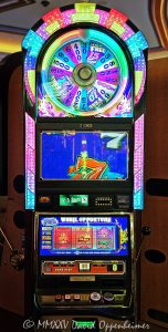 Wheel Of Fortune slot machine at The Venetian Casino by IGT in Las Vegas, Nevada - © 2025 David Oppenheimer - Performance Impressions casino photography archives - https://performanceimpressions.com Wheel Of Fortune slot machine, Wheel Of Fortune, wheel, Night Life, International Game Technology, IGT, slot machine, The Venetian, gaming, casino, Las Vegas, Nevada, slots, odds, win, gambling, wager, bet, luck, jackpot, gamble, quick spin, resort, American Gaming Association, AGA, 3355 S Las Vegas Blvd, 89109, bright, lights, colorful, United States, vertical, color, 1-14977862771