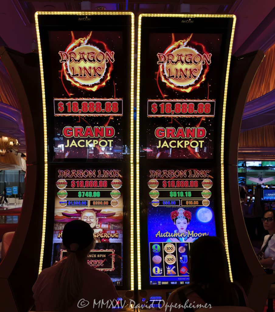 Dragon Link Slot Machines at Wynn Las Vegas Casino Dragon Link slot machines by Aristocrat Gaming at Wynn Las Vegas Resort and Casino in Las Vegas, Nevada - © 2025 David Oppenheimer - Performance Impressions casino photography archives - https://performanceimpressions.com Dragon Link, Aristocrat Gaming, Aristocrat, Dragon Cash, Dragon Link slots, slot machines, slots, Asian-themed, Wynn Casino, casino, gaming, play, betting, odds, win, gambling, wager, bet, luck, gamble, 3355 S Las Vegas Blvd, 89109, Wynn, Encore, Encore Las Vegas, Encore Resort, Encore Casino, Encore Vegas, Encore at Wynn, Wynn Las Vegas, Wynn Vegas, Wynn Resort, Wynn Resorts, 3131 Las Vegas Blvd S, 89109, hotel, resort, WYNN, WYNN stock, five star, five-star, luxury, Las Vegas, Vegas, Las Vegas Strip, casino floor, entertainment, luxury gaming, Nevada casino, vacation, escape, dream, art, fine art, artwork, Nevada, Nevada photography, colorful, wall art, United States, vertical, color, 1-14993092111