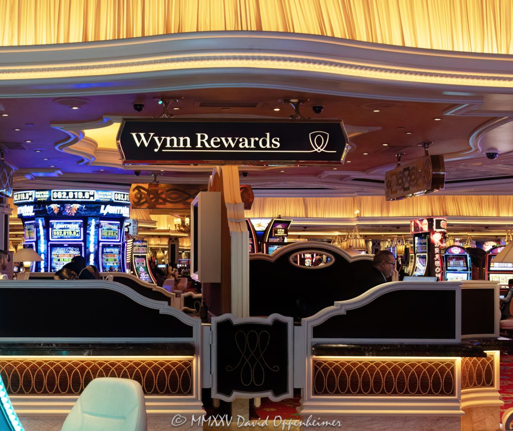 Wynn Rewards Desk on the Casino Floor at Wynn Las Vegas Wynn Rewards desk on the casino floor at Wynn Las Vegas Resort and Casino in Las Vegas, Nevada – © 2025 David Oppenheimer – Performance Impressions casino photography archives – https://performanceimpressions.com Wynn Rewards, Wynn Rewards desk, signage, staff, rewards, slot machines, slots, Wynn Casino, casino, gaming, play, betting, odds, win, gambling, wager, bet, luck, gamble, 3355 S Las Vegas Blvd, 89109, Wynn, players club, club, Encore, Encore Las Vegas, Encore Resort, Encore Casino, Encore Vegas, Encore at Wynn, Wynn Las Vegas, Wynn Vegas, Wynn Resort, Wynn Resorts, 3131 Las Vegas Blvd S, 89109, hotel, resort, WYNN, WYNN stock, five star, five-star, luxury, Las Vegas, Vegas, Las Vegas Strip, casino floor, entertainment, luxury gaming, Nevada casino, vacation, art, casino art, concierge, desk, card, Nevada, Nevada photography, lighting, colorful, United States, vertical, color, 1-14993092111