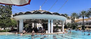 Poolside bar at The Pool at the Wynn Las Vegas Resort and Casino in Las Vegas, Nevada – © 2025 David Oppenheimer – Performance Impressions Travel Photography Archives – https://performanceimpressions.com The Pool, Wynn Pool, pool, swimming, swimming pool, resort pool, poolside, pool deck, poolside bar, bar, cocktails, drinks, mixology, lounge, cabanas, daybeds, umbrellas, palm trees, leisure, relaxation, summer, vacation, entertainment, XS, XS Night Swim, Wynn XS, XS pool party, XS Las Vegas, daytime, resort, casino, hotel, luxury resort, luxury hotel, Las Vegas casino, Las Vegas resort, hospitality, five star, fine art photography, resort photography, travel photography, resort design, architecture, landscape architecture, design, modern, contemporary, luxury lifestyle, reflections, water reflections, turquoise, blue, elegant, opulent, Wynn Las Vegas, Wynn, Wynn Resort, Wynn Casino, Wynn Resorts, Encore Las Vegas, Encore Resort, Encore Casino, Encore at Wynn, Las Vegas, Vegas, Nevada, Las Vegas Strip, 3131 Las Vegas Blvd S, 89109, United States, USA, horizontal, color, 1-14993092112